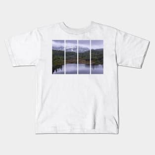 Wonderful landscapes in Norway. Vestland. Beautiful scenery of houses with grass roof. Norwegian traditional architecture Mountains, trees and snow in background. Cloudy day Kids T-Shirt